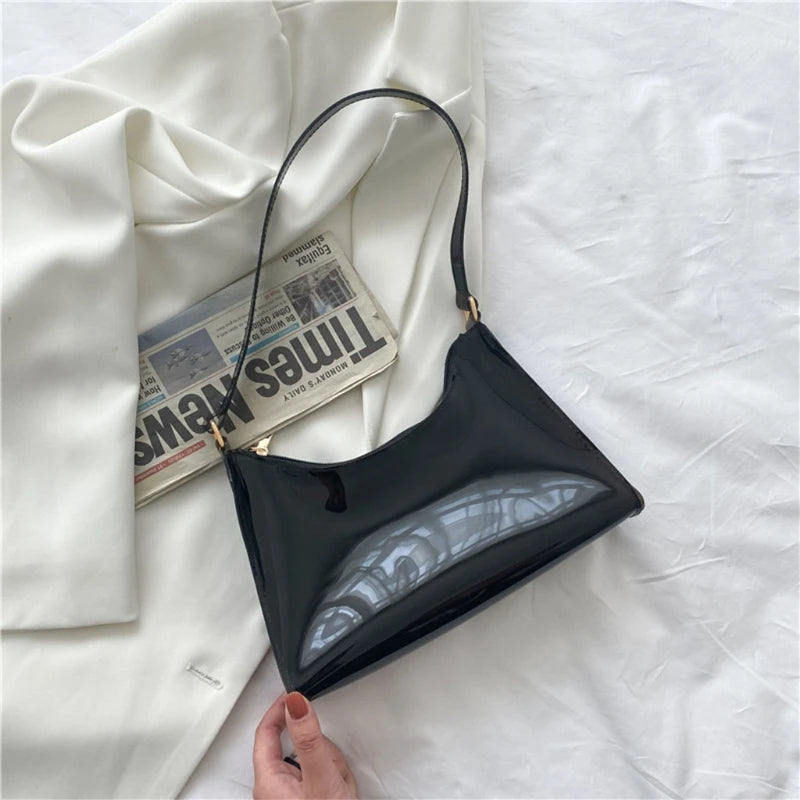 At Off The Dome by Makeda Iroquois, step into Y2K fashion with Off The Dome's Vivid Transparent Shoulder Bag. This statement accessory blends nostalgia with modern style.