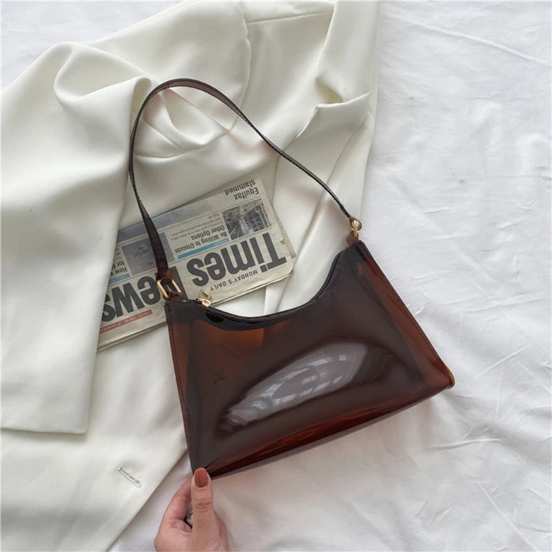 At Off The Dome by Makeda Iroquois, step into Y2K fashion with Off The Dome's Vivid Transparent Shoulder Bag. This statement accessory blends nostalgia with modern style.