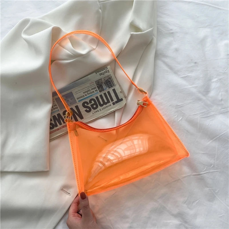At Off The Dome by Makeda Iroquois, step into Y2K fashion with Off The Dome's Vivid Transparent Shoulder Bag. This statement accessory blends nostalgia with modern style.