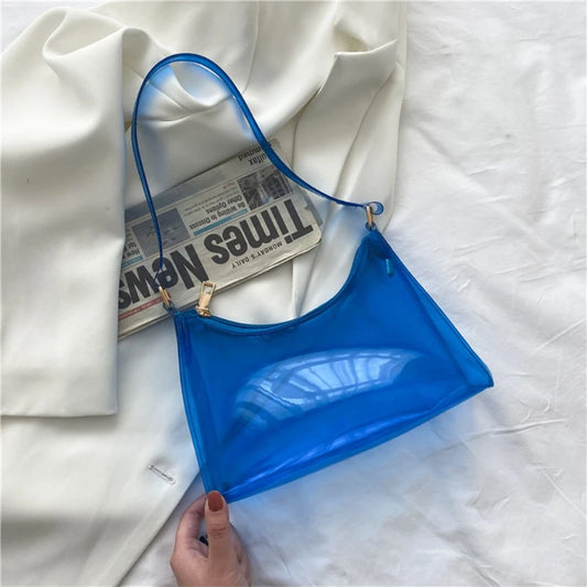 At Off The Dome by Makeda Iroquois, step into Y2K fashion with Off The Dome's Vivid Transparent Shoulder Bag. This statement accessory blends nostalgia with modern style.